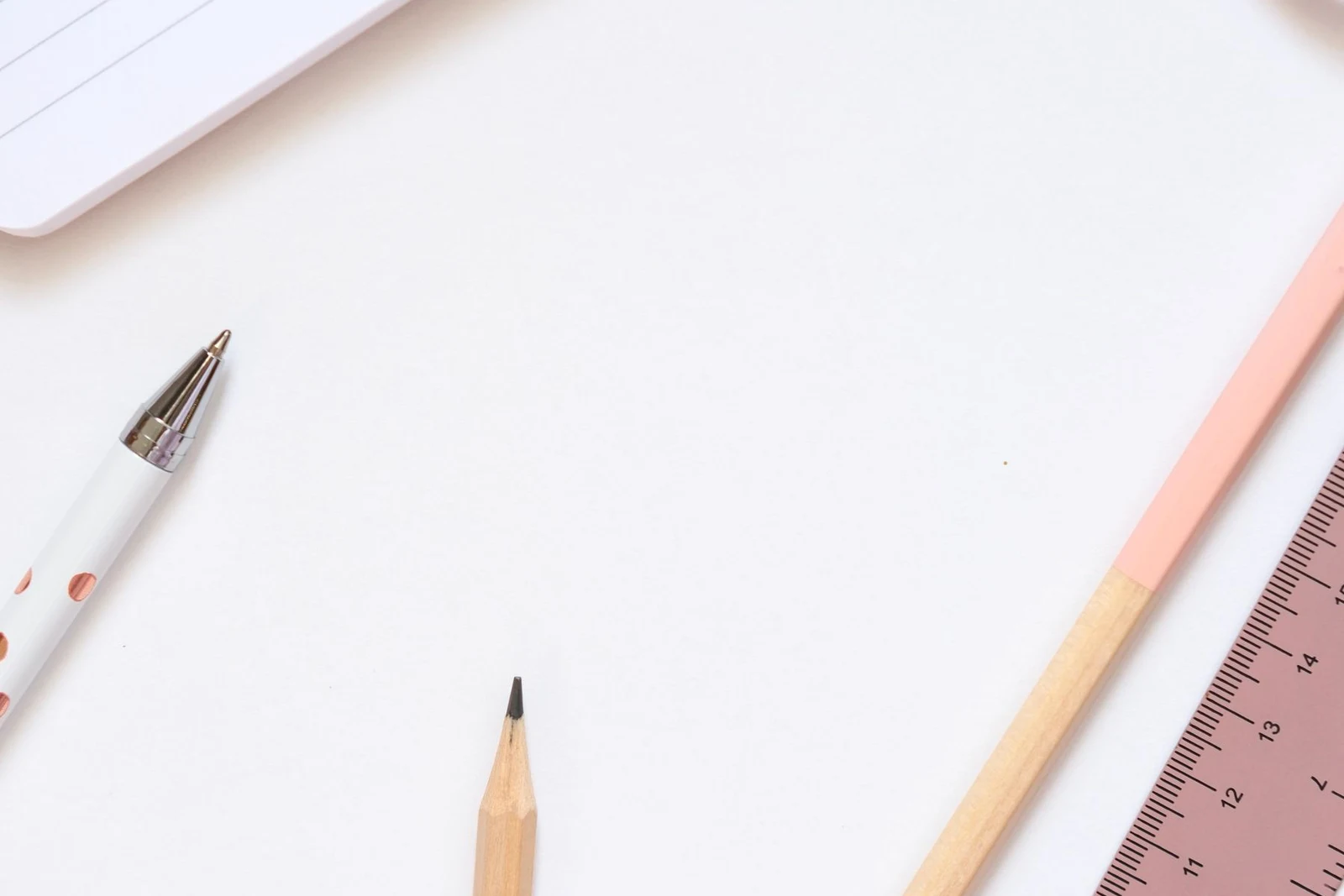 Notebook and stationery arranged on a light surface; generic category illustration, not Daiso inventory