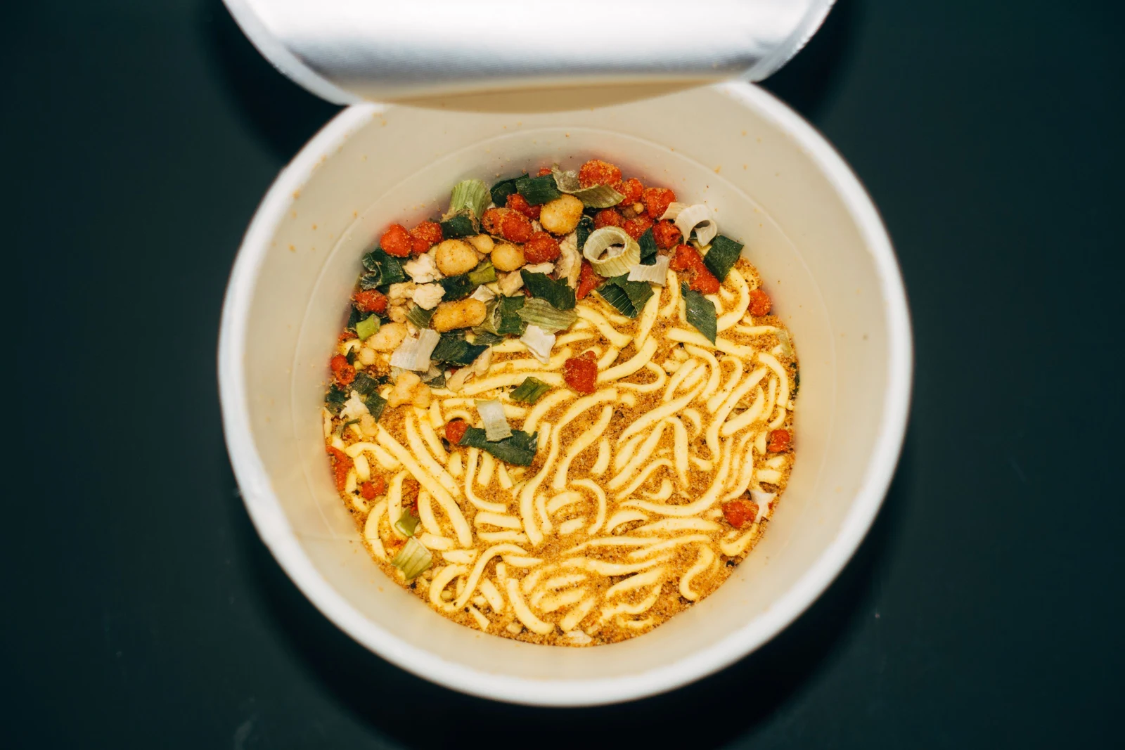Overhead view of an open cup of instant noodles before preparation