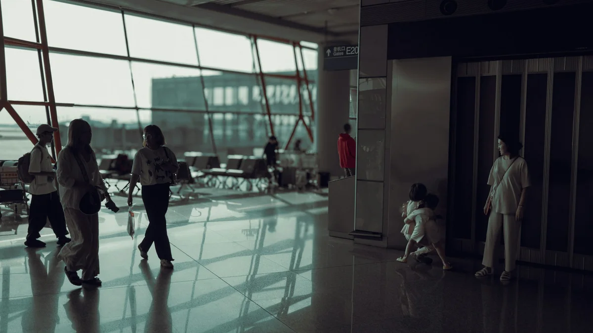Travelers walking through Incheon International Airport