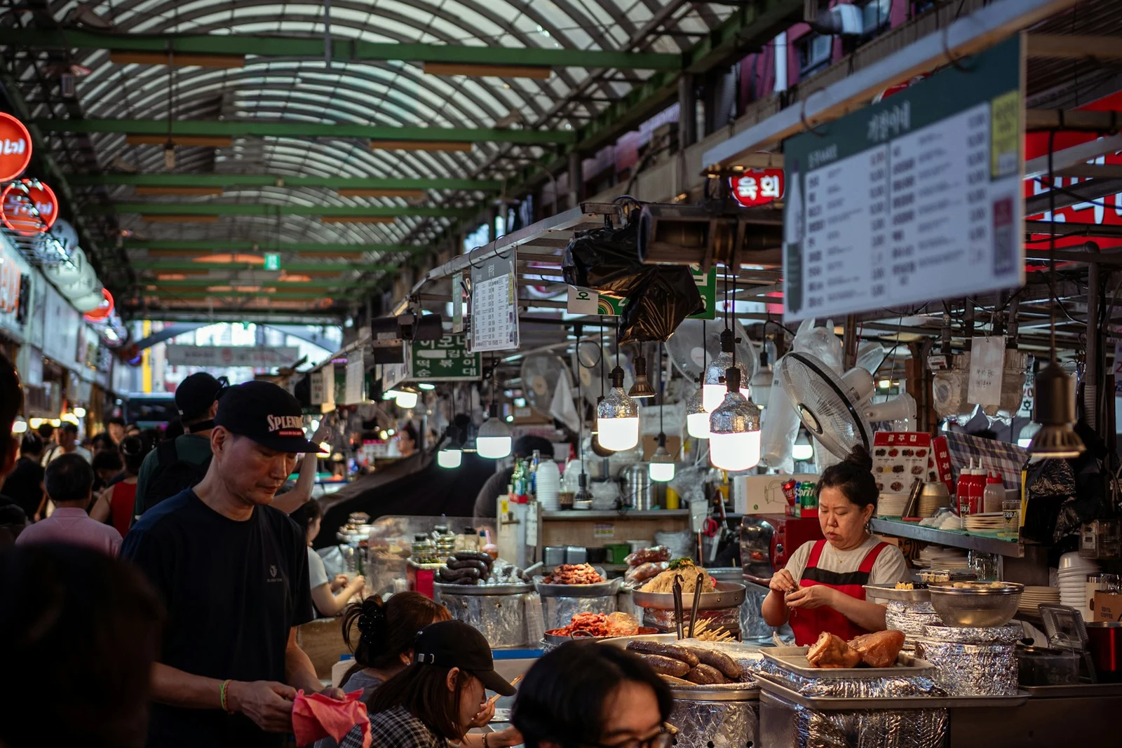 Vendors and shoppers beneath the roof of Gwangjang Market