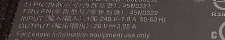 Laptop power adapter label showing INPUT 100–240V 50–60Hz above OUTPUT 20V