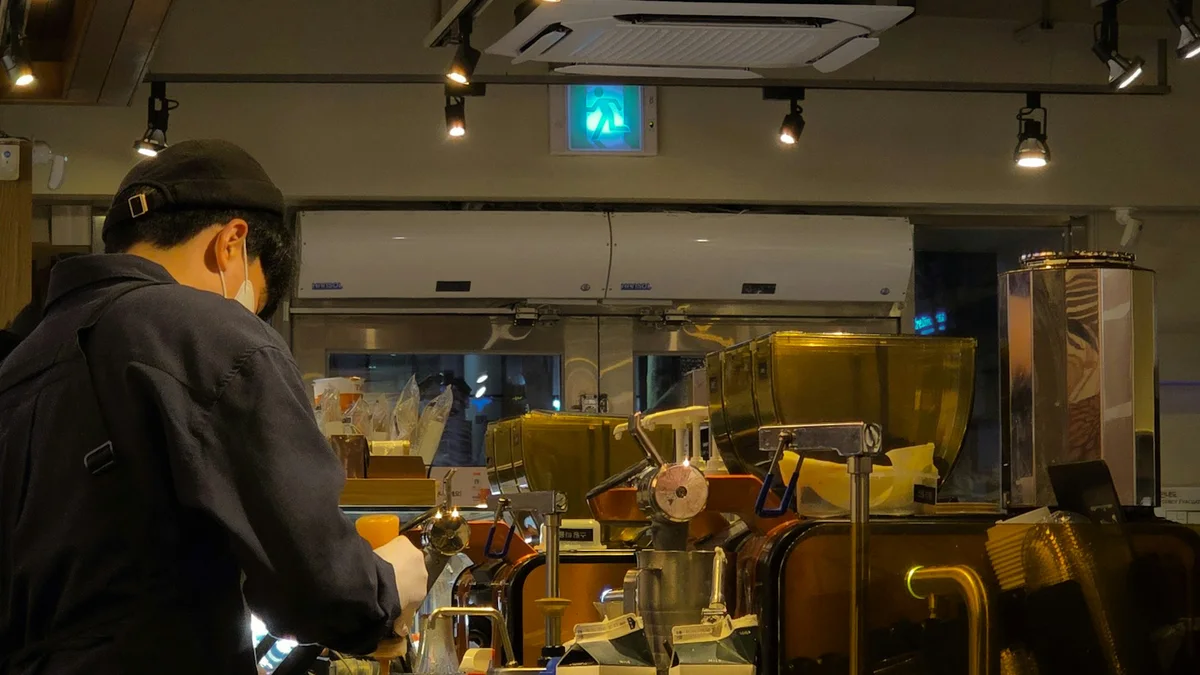 A barista working behind the counter of a cafe in Gwacheon